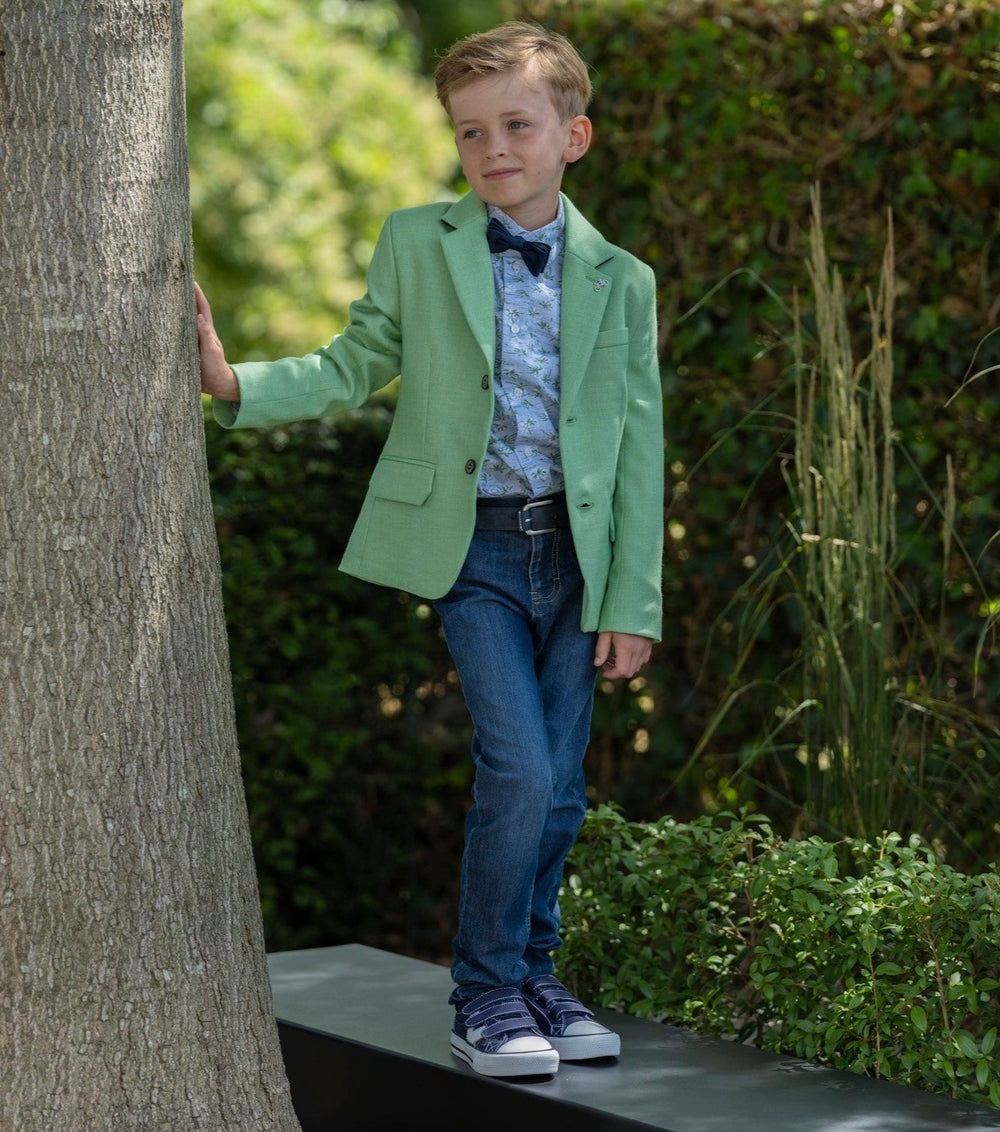 Classic jeans look with green blazer, bow tie and blue print shirt