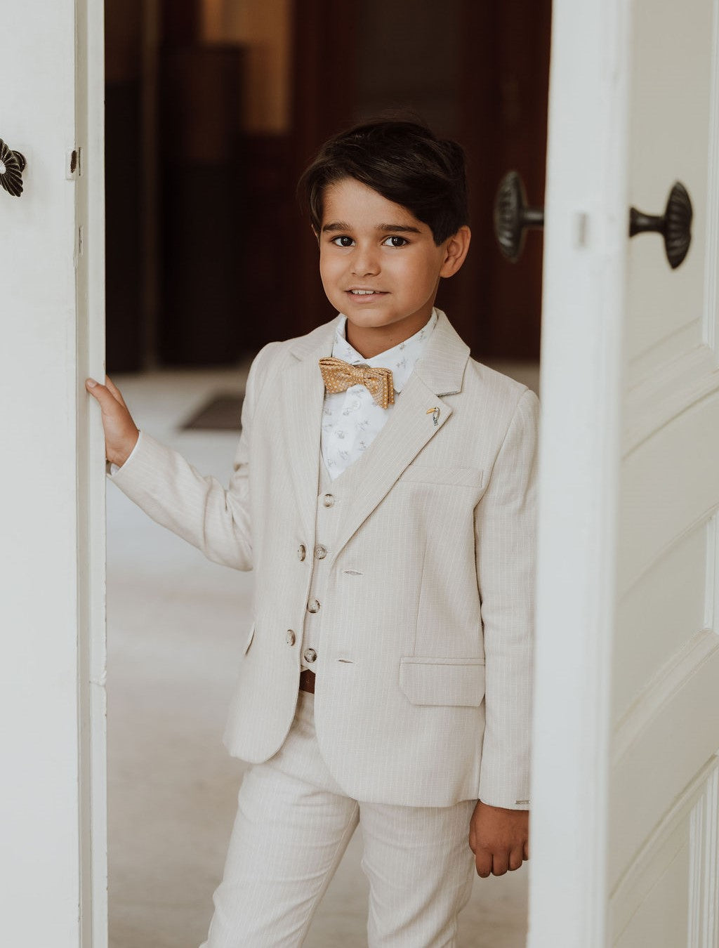 Driedelig beige kostuum