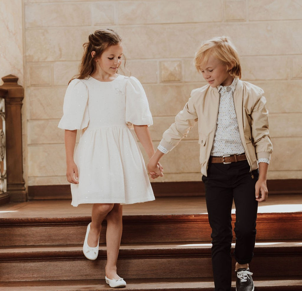 Feestjurk met strik en glitters