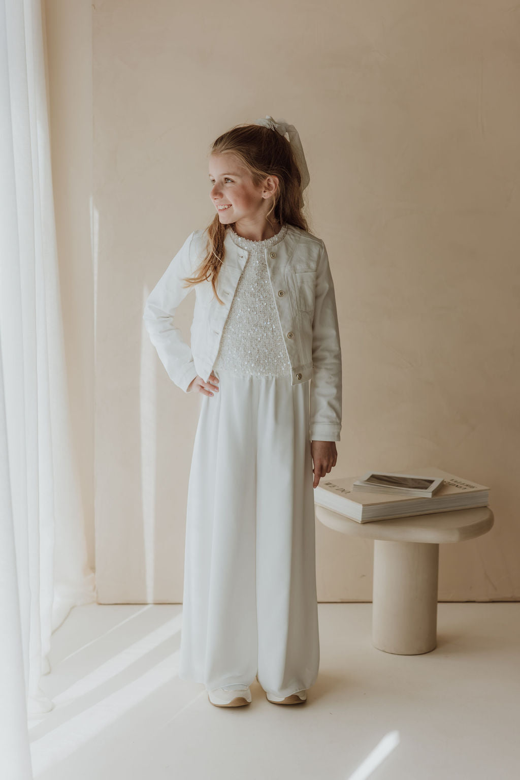 Stralende communielook met pailletten
