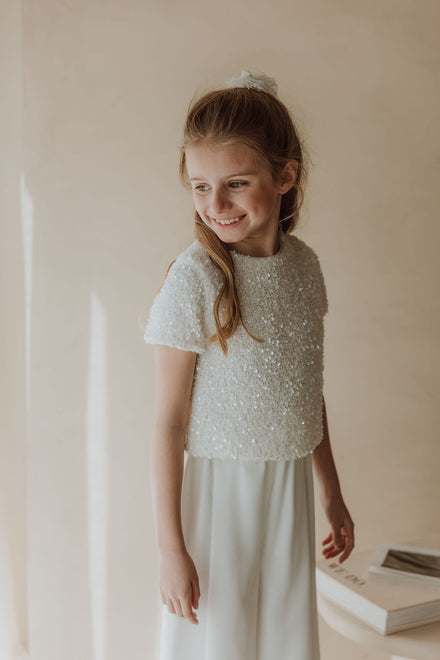 Stralende communielook met pailletten