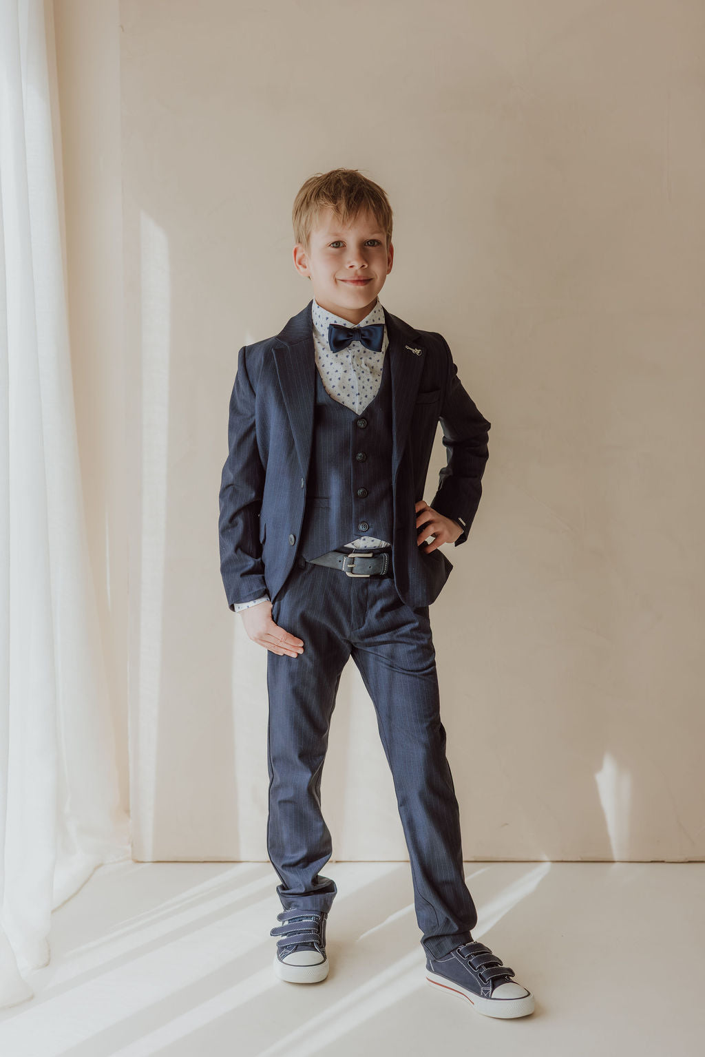 Dark blue three-piece suit with white printed shirt