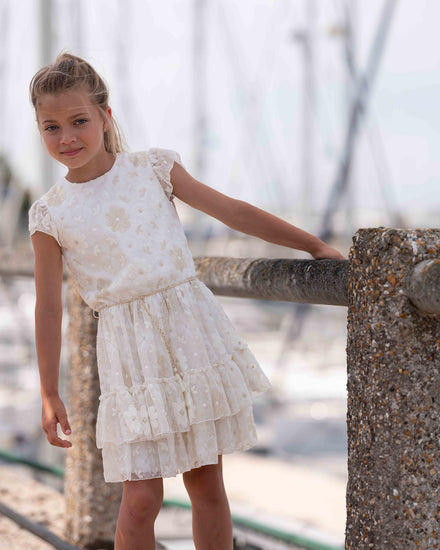 Gelaagd jurkje met bloemen gecombineerd met jacket in lederlook