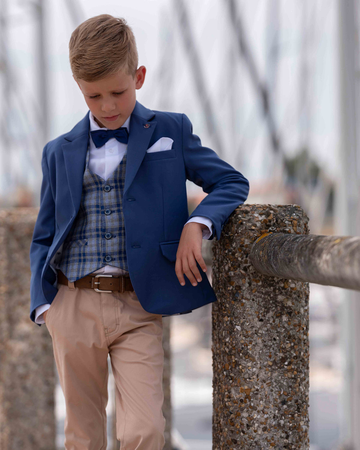 Blue blazer with checked waistcoat and long beige trousers  GYMP