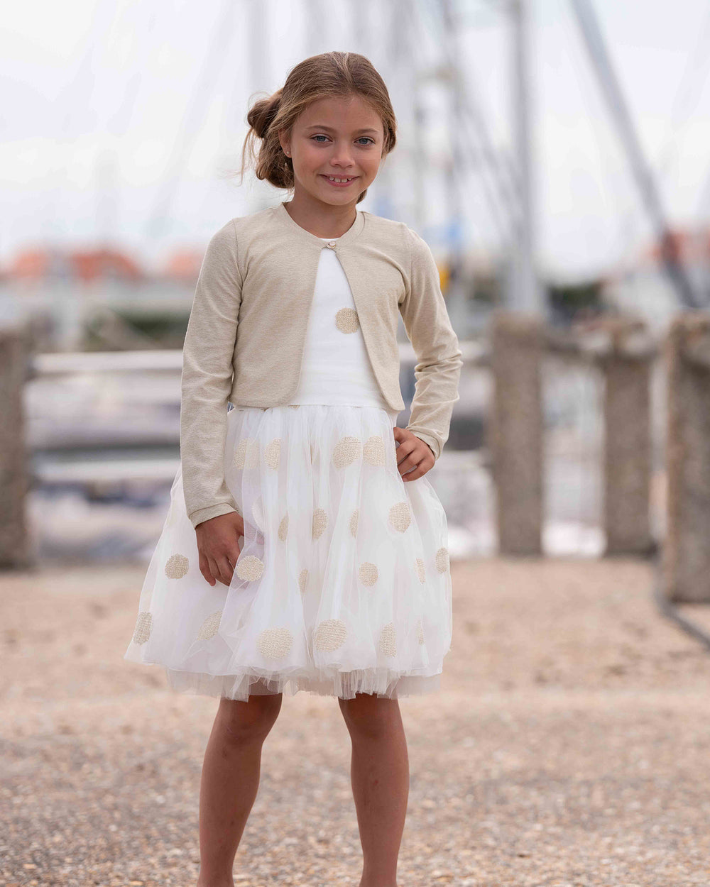 Pearl white tulle dress with gold dots and matching cardigan